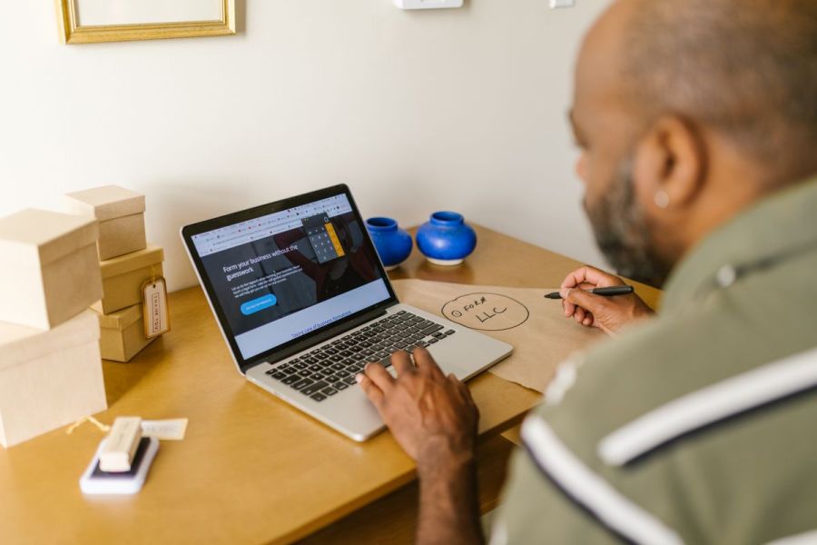 Business owner reviewing a website on a laptop